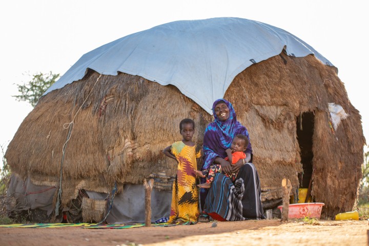 Pasoralist Fatuma pictured outside of her home in Tana River County, Madogo division. She has 6 children. Her 7-year-old boy has had meningitis from when he was 2 months old and requires expensive medication.